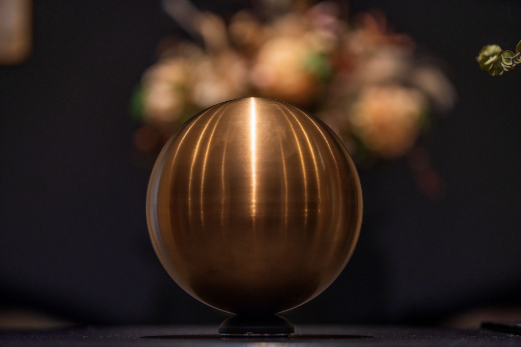 Placing the spherical urn